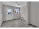 A room with new light-gray flooring and walls; natural light floods in from a sunny window at 1509 Stone Gate Ln, Atlanta, GA 30317