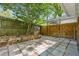 Paved patio in backyard featuring planters and privacy fence at 3700 Sexton Woods Dr, Chamblee, GA 30341