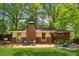Rear exterior featuring a deck, a fireplace area, and chairs at 3700 Sexton Woods Dr, Chamblee, GA 30341