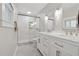 Modern bathroom featuring a double sink vanity, glass-enclosed shower, and updated fixtures at 3700 Sexton Woods Dr, Chamblee, GA 30341