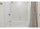 Bright bathroom featuring a clean, white tiled shower and bathtub at 3700 Sexton Woods Dr, Chamblee, GA 30341