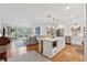 Bright kitchen featuring a central island with barstool seating, stainless appliances, and an open layout at 3700 Sexton Woods Dr, Chamblee, GA 30341