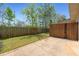 Fenced backyard features a concrete patio and a grassy area, perfect for outdoor enjoyment at 3983 Fireoak Dr, Decatur, GA 30032