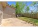 Fenced backyard with a lawn and concrete patio area at 3983 Fireoak Dr, Decatur, GA 30032