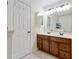Bathroom with double sinks and dark wood cabinetry at 3983 Fireoak Dr, Decatur, GA 30032