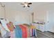 Inviting bedroom featuring a ceiling fan, light gray walls, and dark flooring at 3983 Fireoak Dr, Decatur, GA 30032