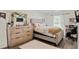 Bedroom featuring a neutral color scheme, large window and dresser at 3983 Fireoak Dr, Decatur, GA 30032