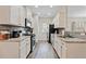 Modern kitchen boasting white cabinets, stainless appliances, and granite countertops at 3983 Fireoak Dr, Decatur, GA 30032