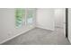 Cozy bedroom featuring neutral carpet and natural light from a window at 4437 Ben Hill Rd, Atlanta, GA 30349