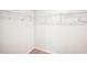 Spacious walk-in closet offers ample storage with wire shelving and neutral carpeting at 4437 Ben Hill Rd, Atlanta, GA 30349