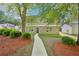 Charming two-story home with a brick facade and well-maintained landscaping at 4437 Ben Hill Rd, Atlanta, GA 30349