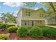 Two-story home with manicured shrubbery, brick base and neutral siding at 4437 Ben Hill Rd, Atlanta, GA 30349