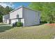 A two-story home with attached garage, complemented by a lush green lawn at 4437 Ben Hill Rd, Atlanta, GA 30349