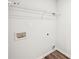 A well-equipped laundry room featuring utility connections and convenient overhead shelving at 4437 Ben Hill Rd, Atlanta, GA 30349