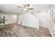 Open-concept living area with wood-look floors and a ceiling fan at 4437 Ben Hill Rd, Atlanta, GA 30349