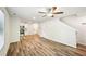 Spacious living area with a ceiling fan and modern wood-look flooring at 4437 Ben Hill Rd, Atlanta, GA 30349