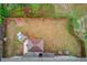 An aerial view displays a fenced backyard featuring a cozy gazebo and fireplace feature for outdoor living at 1633 Park Hollow Ln, Lawrenceville, GA 30043