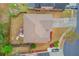 An aerial view showcases the home's roof, landscaped yard, long driveway, and neighborhood street at 1633 Park Hollow Ln, Lawrenceville, GA 30043