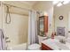 Bathroom featuring a shower and tub combination with a vanity offering lots of storage at 1633 Park Hollow Ln, Lawrenceville, GA 30043
