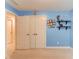 Bedroom featuring blue walls, closet, and decorative shelves, perfect for personalization at 1633 Park Hollow Ln, Lawrenceville, GA 30043