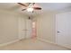 Bedroom featuring neutral carpet and walls, closet, and ceiling fan at 1633 Park Hollow Ln, Lawrenceville, GA 30043