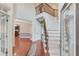 Grand foyer with a staircase, hardwood floors, and view into kitchen at 1633 Park Hollow Ln, Lawrenceville, GA 30043