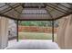 Cozy gazebo overlooking a fenced backyard, perfect for outdoor entertaining at 1633 Park Hollow Ln, Lawrenceville, GA 30043