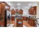 Well-lit kitchen featuring stainless steel appliances, granite countertops, and ample cabinet space at 1633 Park Hollow Ln, Lawrenceville, GA 30043