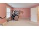 Home office space featuring pink walls, a desk, and ample room for productivity at 1633 Park Hollow Ln, Lawrenceville, GA 30043