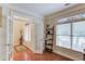 Bright home office with hardwood floors, large windows, and glass French doors at 1633 Park Hollow Ln, Lawrenceville, GA 30043