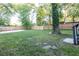 Fenced backyard with mature trees and a large lawn at 22 Vinson Se Dr, Atlanta, GA 30317