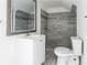 Modern bathroom with tiled shower, vanity, sink, and toilet at 22 Vinson Se Dr, Atlanta, GA 30317