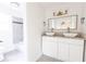 Bright bathroom featuring double sink with modern fixtures and granite countertop at 22 Vinson Se Dr, Atlanta, GA 30317