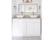 Bathroom featuring double sink with modern fixtures, cabinets, and a large mirror at 22 Vinson Se Dr, Atlanta, GA 30317