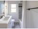 Clean bathroom featuring tile accents, shower and tub combo at 22 Vinson Se Dr, Atlanta, GA 30317