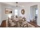 Elegant dining room with seating for eight and modern lighting fixture at 22 Vinson Se Dr, Atlanta, GA 30317