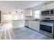 Modern kitchen with stainless steel appliances, granite countertops, and tile flooring at 22 Vinson Se Dr, Atlanta, GA 30317