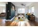 Bright living room featuring hardwood floors, modern decor, and large windows at 22 Vinson Se Dr, Atlanta, GA 30317