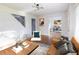 Inviting living area featuring hardwood floors, a stylish accent chair, and ample natural light at 22 Vinson Se Dr, Atlanta, GA 30317