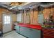 Basement includes a work area with workbench, shelving, and organized storage solutions at 3450 N Cook Rd, Powder Springs, GA 30127