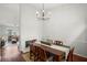 A dining room featuring hardwood floors, decorative molding, and an adjacent sitting room at 3450 N Cook Rd, Powder Springs, GA 30127