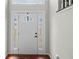 Bright entryway features a white front door with decorative glass sidelights at 3450 N Cook Rd, Powder Springs, GA 30127