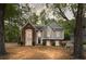 Charming two-story home features a well-manicured front yard and beautiful brick and siding accents at 3450 N Cook Rd, Powder Springs, GA 30127