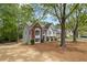 Charming two-story home features a well-manicured front yard and beautiful brick and siding accents at 3450 N Cook Rd, Powder Springs, GA 30127