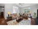 Comfortable living room with hardwood floors, a ceiling fan, and a neutral color palette at 3450 N Cook Rd, Powder Springs, GA 30127