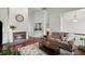 Inviting living room with hardwood floors, a brick fireplace, and ample natural light at 3450 N Cook Rd, Powder Springs, GA 30127
