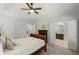A spacious main bedroom boasting a tray ceiling, neutral walls, and a connecting bathroom at 3450 N Cook Rd, Powder Springs, GA 30127