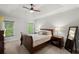 A cozy bedroom featuring a tray ceiling, plush carpet, and neutral tones creating a serene atmosphere at 3450 N Cook Rd, Powder Springs, GA 30127