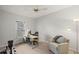 Bright office space with desk, chair, and window view; ideal for work or study at 3450 N Cook Rd, Powder Springs, GA 30127