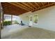A covered outdoor patio offers shade and access to the backyard at 3450 N Cook Rd, Powder Springs, GA 30127